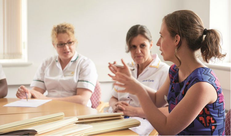 Researchers around table